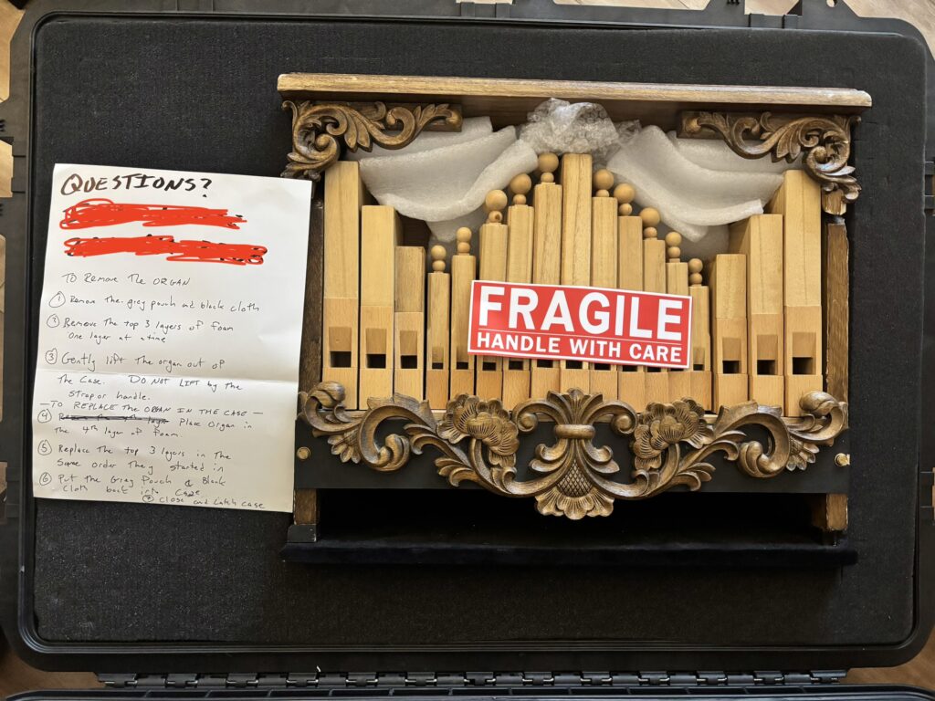 busker organ in case for flying