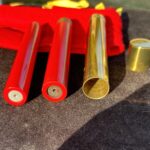 brass tube with cap and two firecrackers for a magic trick