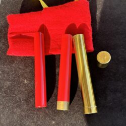 brass tube with cap and two firecrackers for a magic trick