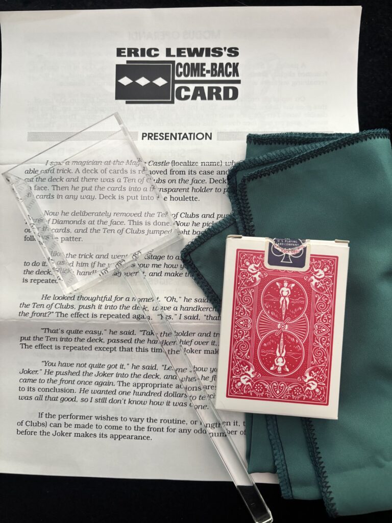 vintage magic trick with a deck of cards, scarf and holder