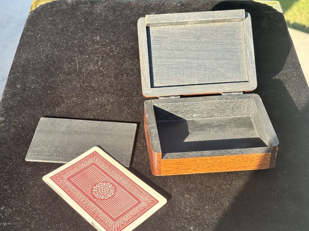 wooden box with a playing card