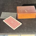 wooden box for holding playing cards for a magic trick