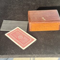 wooden box for holding playing cards for a magic trick