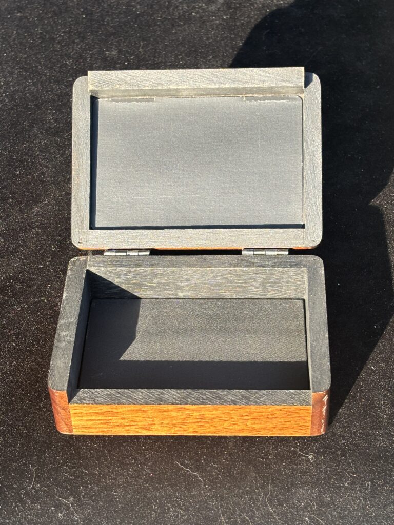 wooden box for holding playing cards for a magic trick