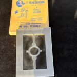 metal frame with glass and vintage magic trick box
