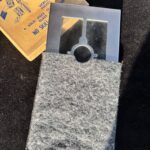 metal frame with glass and vintage magic trick box