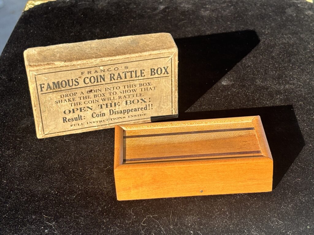 wooden box and vintage magic trick packaging