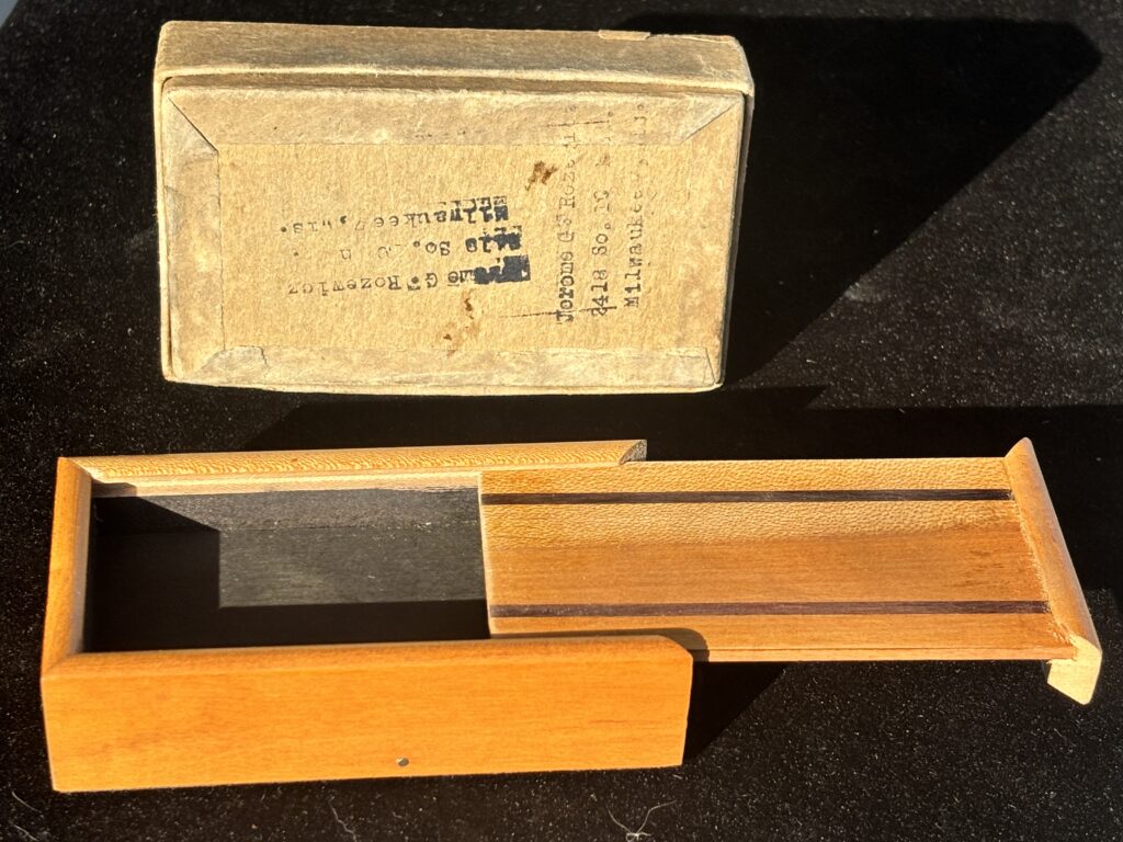 wooden box and vintage magic trick packaging