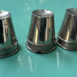 Three metal cups for the cups and balls magic trick