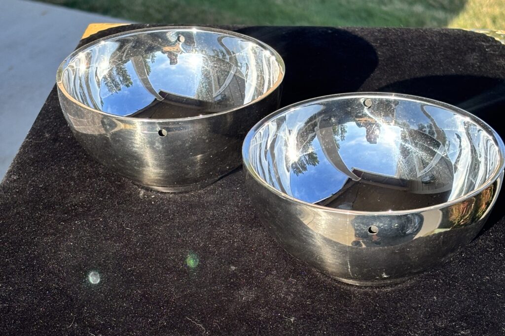 two metal bowls for holding water for the water from above magic trick